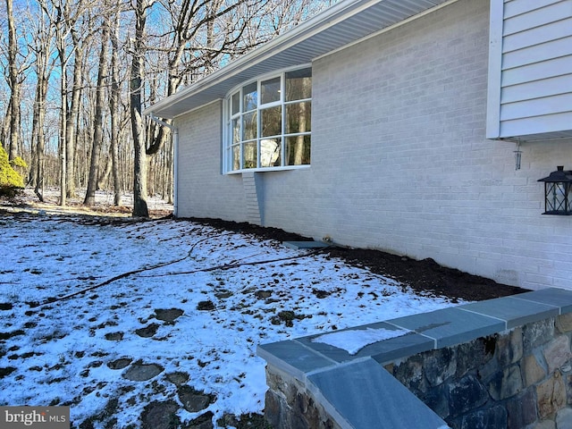 view of snow covered property