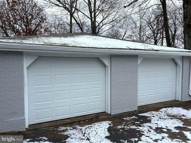 view of snow covered garage