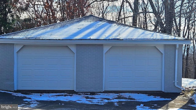 view of snow covered garage