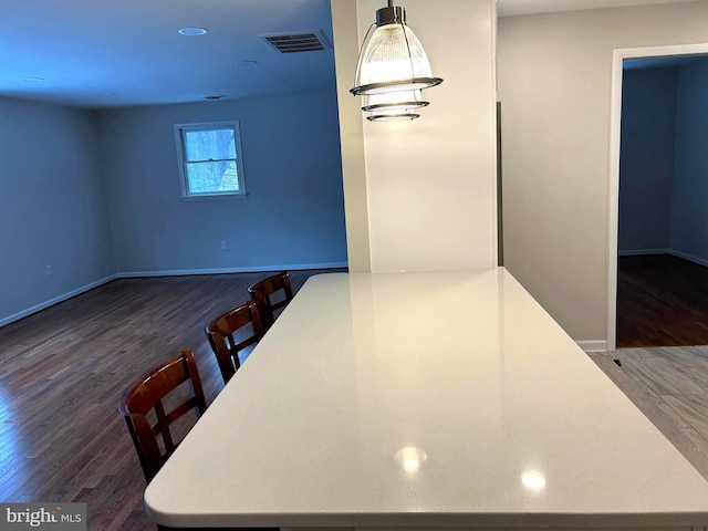 unfurnished dining area with dark hardwood / wood-style flooring