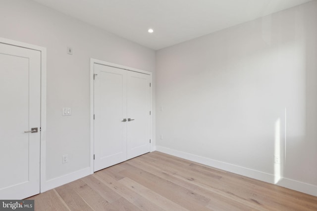 unfurnished bedroom with light hardwood / wood-style floors