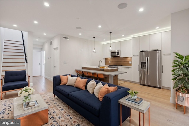 1610 Germantown Ave Unit C, Philadelphia, PA 19122 - living room with recessed lighting, light wood-style flooring, and stairway