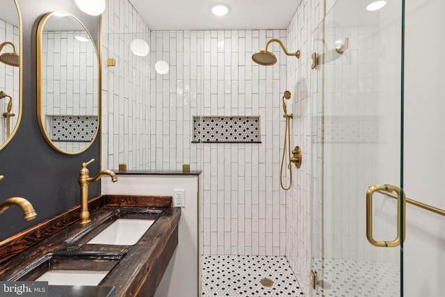 bathroom featuring vanity and an enclosed shower