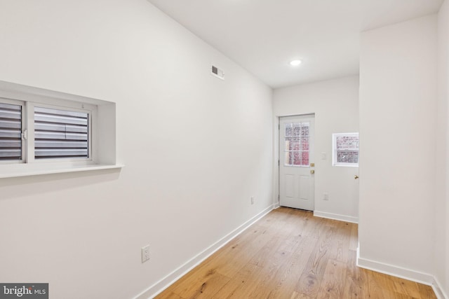 hall with light wood-type flooring