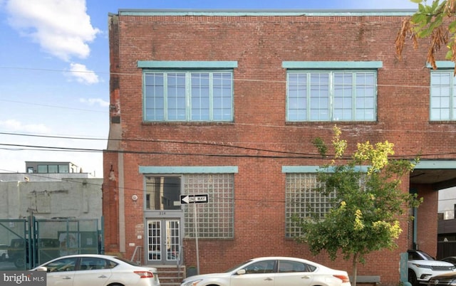 view of front of home featuring brick siding