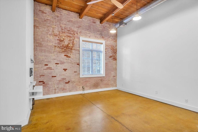 unfurnished room featuring baseboards, wooden ceiling, brick wall, concrete flooring, and beam ceiling