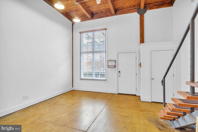 foyer with beamed ceiling and wood ceiling