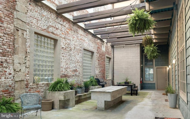 view of patio / terrace featuring a pergola and area for grilling