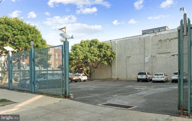 view of gate with fence