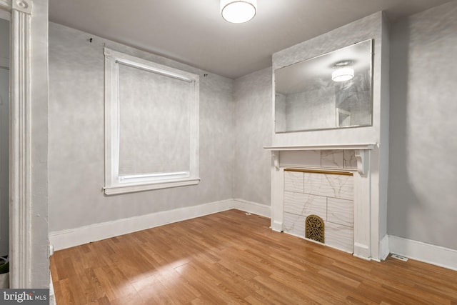 unfurnished living room featuring hardwood / wood-style flooring