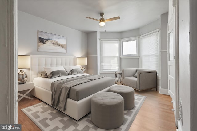 bedroom featuring ceiling fan and light hardwood / wood-style flooring