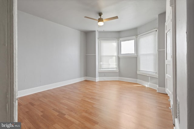 unfurnished room with ceiling fan and light hardwood / wood-style floors