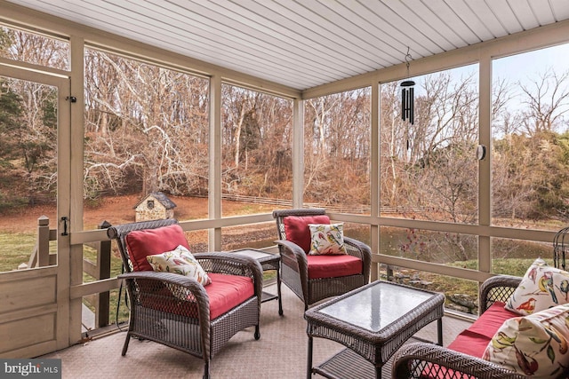 sunroom featuring wooden ceiling