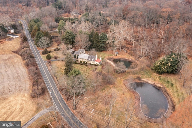 birds eye view of property featuring a water view