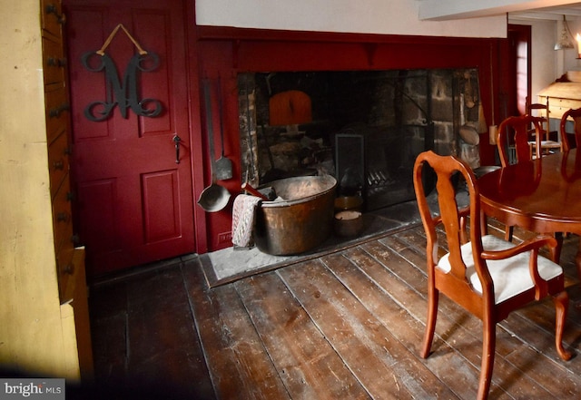 dining space featuring dark wood-type flooring