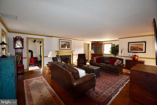 living room with dark hardwood / wood-style floors and ornamental molding