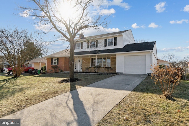 view of front property featuring a front yard and a garage