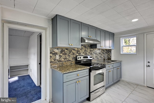 kitchen with gray cabinetry, sink, dark stone countertops, stainless steel range with electric stovetop, and decorative backsplash