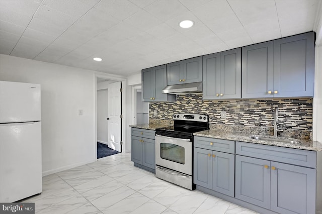 kitchen with light stone countertops, sink, white fridge, stainless steel electric stove, and decorative backsplash