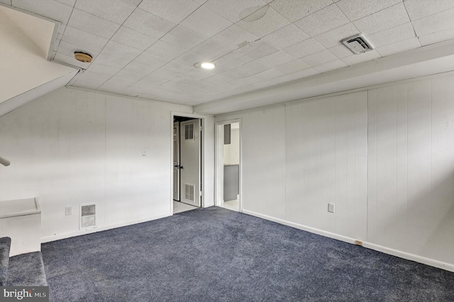 empty room featuring dark colored carpet