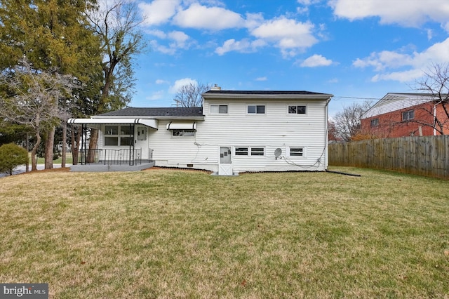 rear view of house with a yard