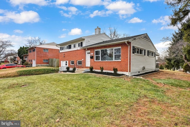 rear view of house with a lawn