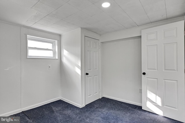 interior space with carpet and ornamental molding