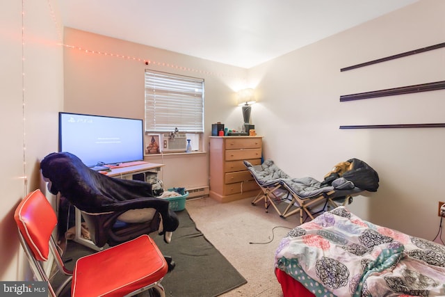 carpeted bedroom featuring cooling unit and a baseboard heating unit