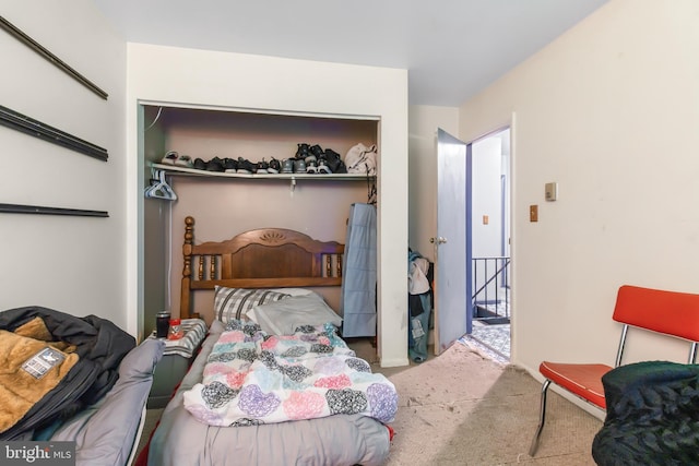 bedroom with a closet and carpet