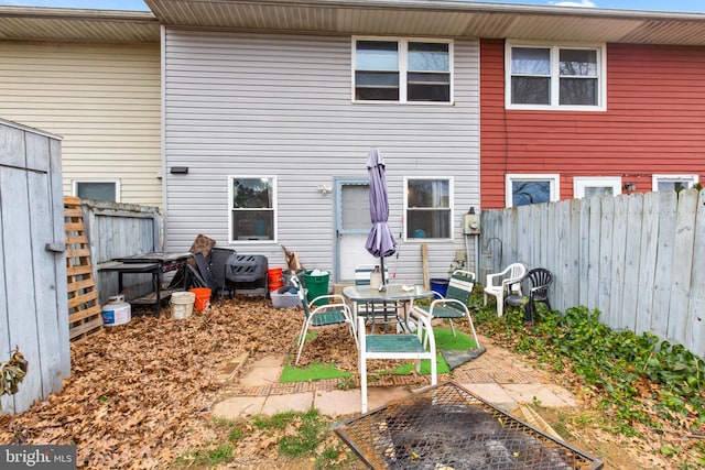 rear view of property featuring a patio area