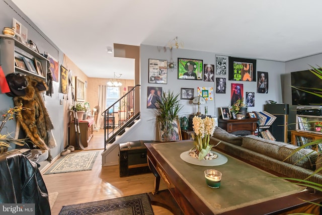 living room featuring a notable chandelier and wood-type flooring