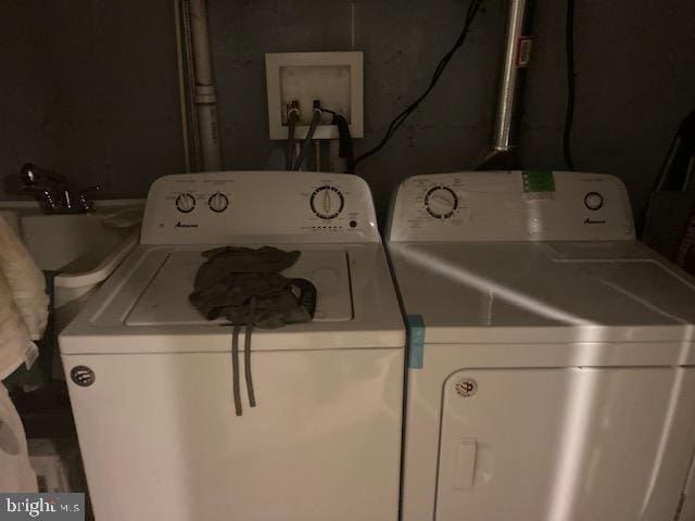 laundry room with separate washer and dryer