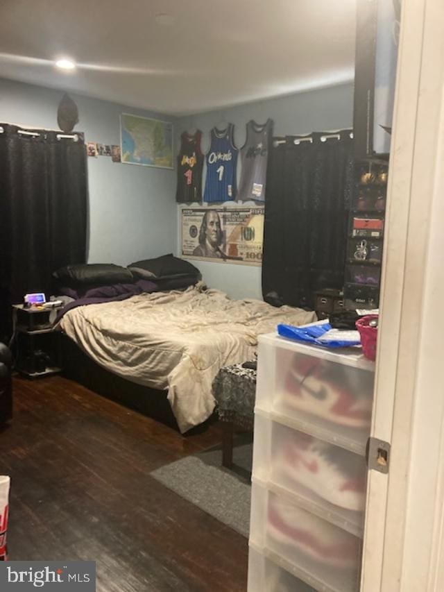 bedroom featuring dark hardwood / wood-style flooring