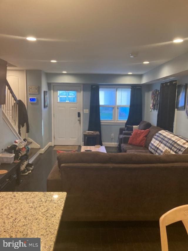 living room featuring dark wood-type flooring