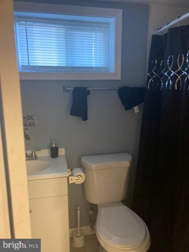 bathroom with vanity and toilet