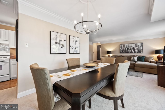 carpeted dining area with ornamental molding and a notable chandelier