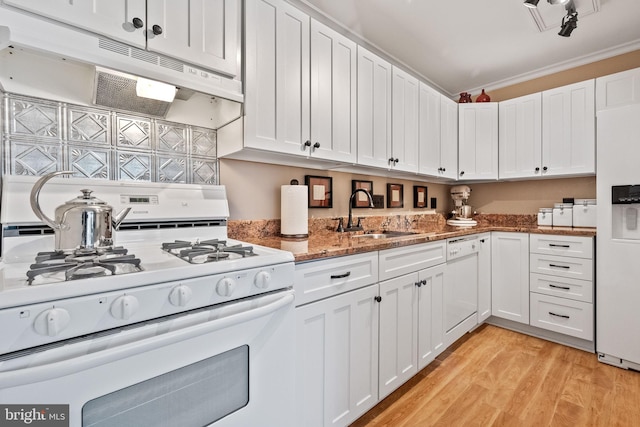 kitchen featuring white cabinets, white appliances, and sink