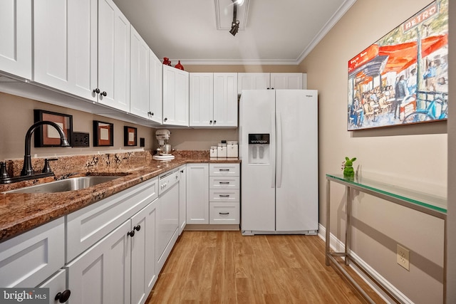 kitchen with white appliances, crown molding, sink, light hardwood / wood-style flooring, and white cabinetry