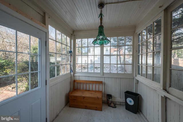 sunroom / solarium featuring wood ceiling