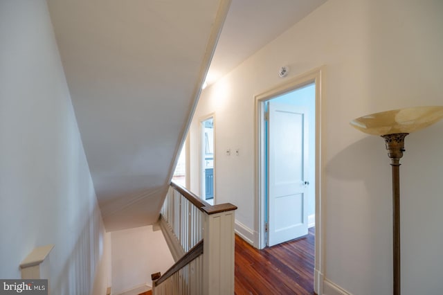 stairs featuring hardwood / wood-style flooring