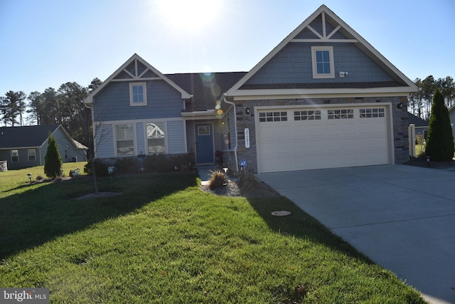 view of front of property with a garage and a front lawn