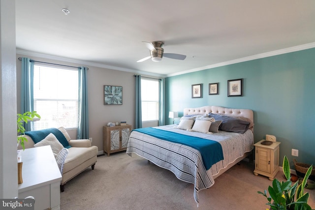 carpeted bedroom with ceiling fan, ornamental molding, and multiple windows