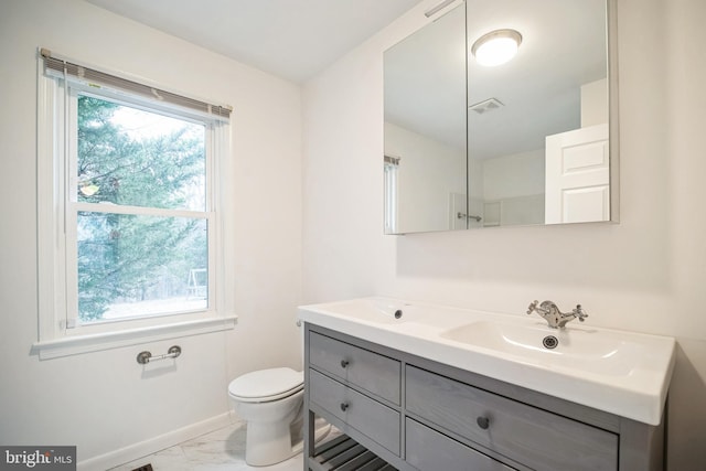 bathroom with vanity and toilet