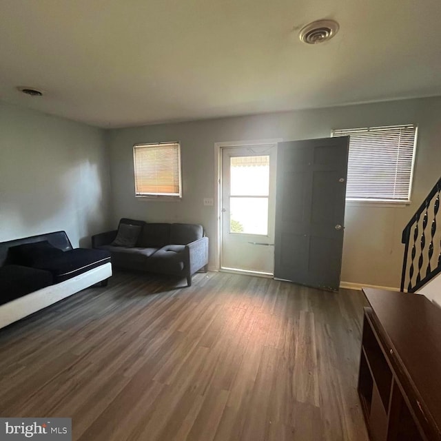 unfurnished living room featuring wood-type flooring