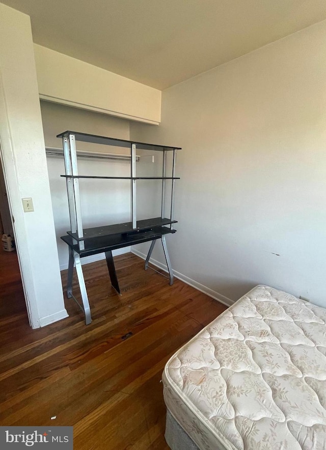 bedroom featuring dark hardwood / wood-style floors