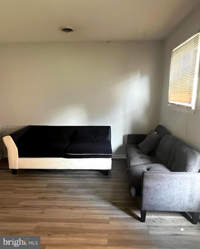 living area with hardwood / wood-style floors