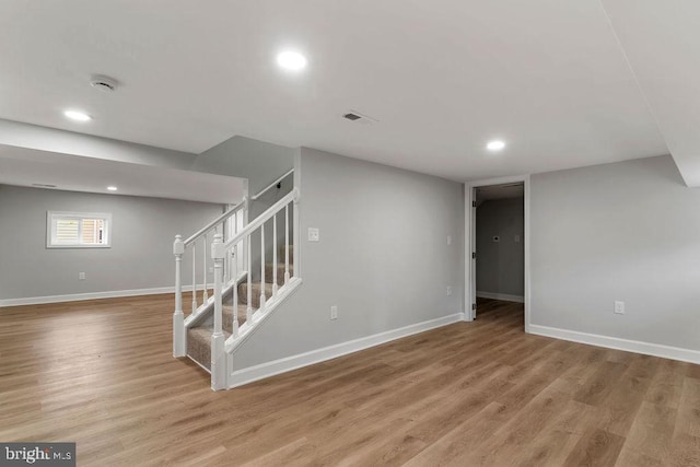 basement featuring light hardwood / wood-style flooring