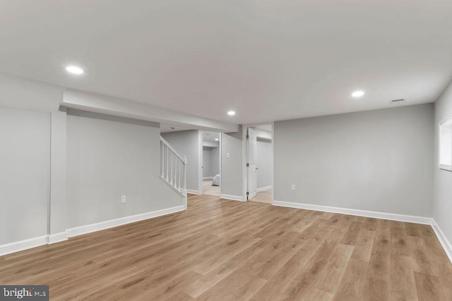 basement featuring light hardwood / wood-style floors