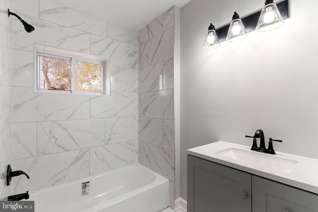 bathroom with vanity and tiled shower / bath