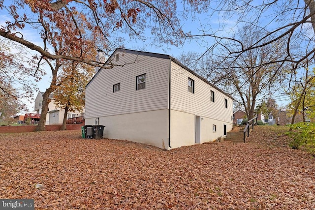 view of home's exterior with central AC